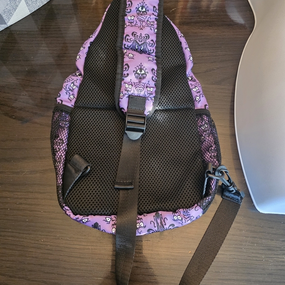 Haunted Mansion-themed sling backpack is a purple crossbody bag - Picture 2 of 8